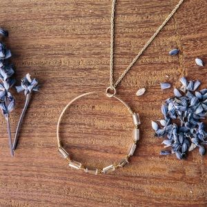 Circle pendent with wire wrapped glass beads.